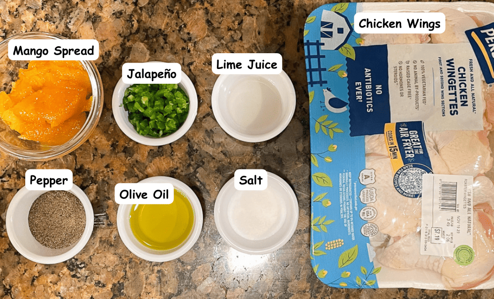 Mango jalapeno wing ingredients. Chicken wings, mango spread, jalapeños, lime juice, pepper, olive oil, salt. 