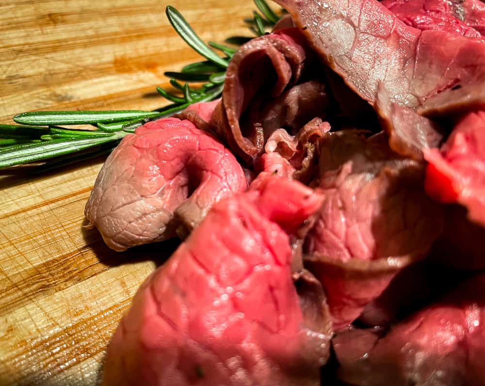 Thinly sliced roast beef with rosemary