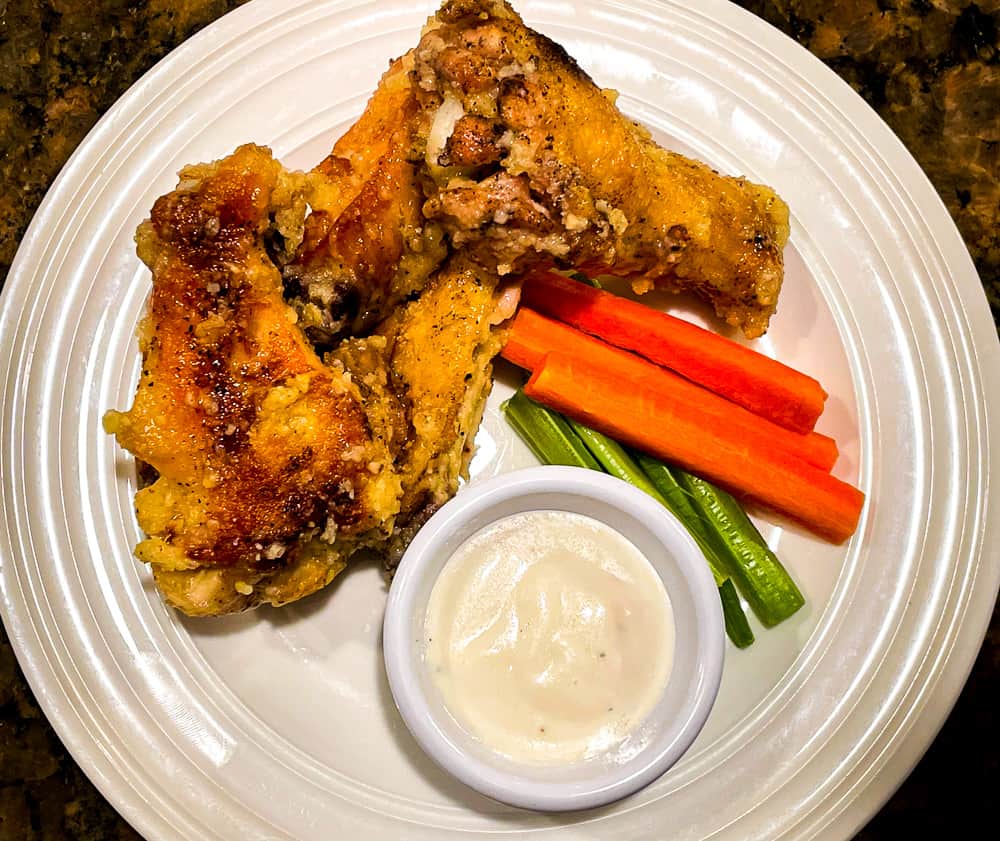 Garlic parmesan wings with carrots, celery, and bleu cheese dressing. 