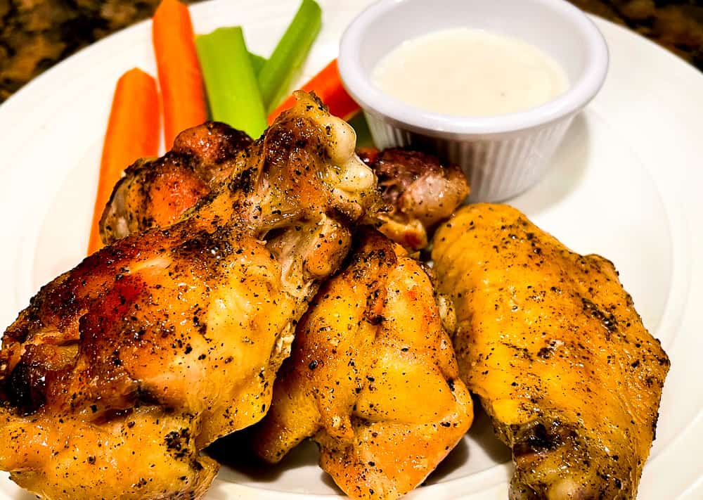 Lemon pepper wings with celery, carrots, and bleu cheese dressing.